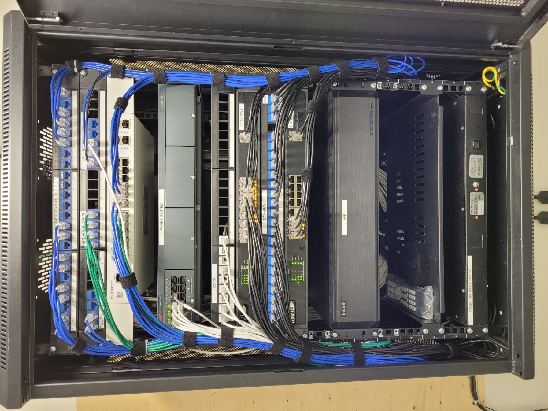 Cabinet with cable management and network hardware