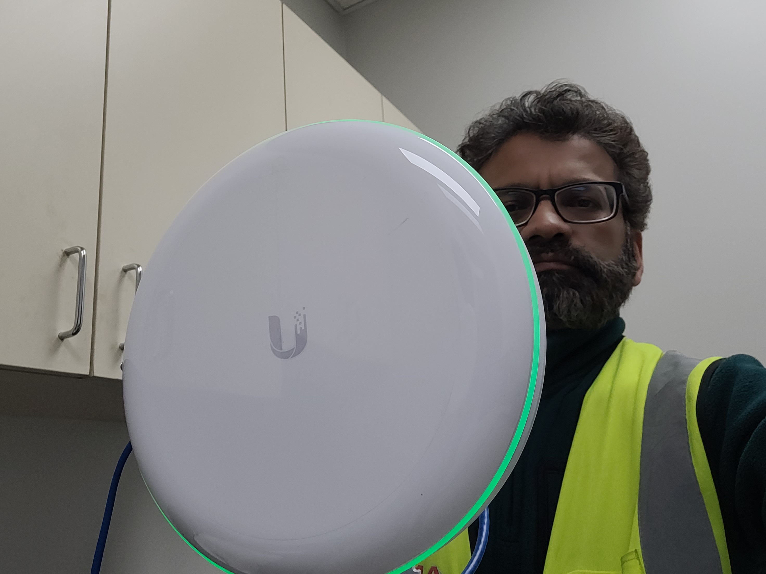 Outdoor access point mounted on building exterior