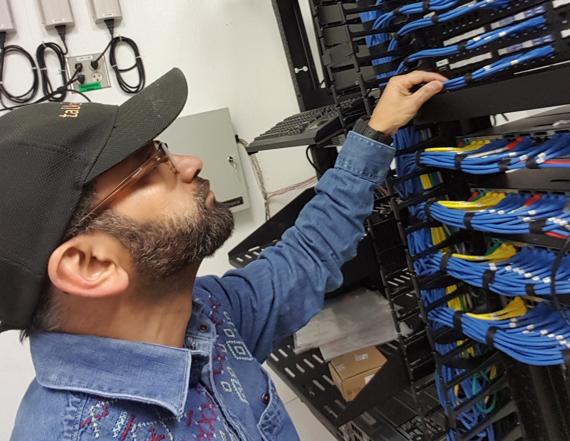 Technician installing network cabling in a commercial building